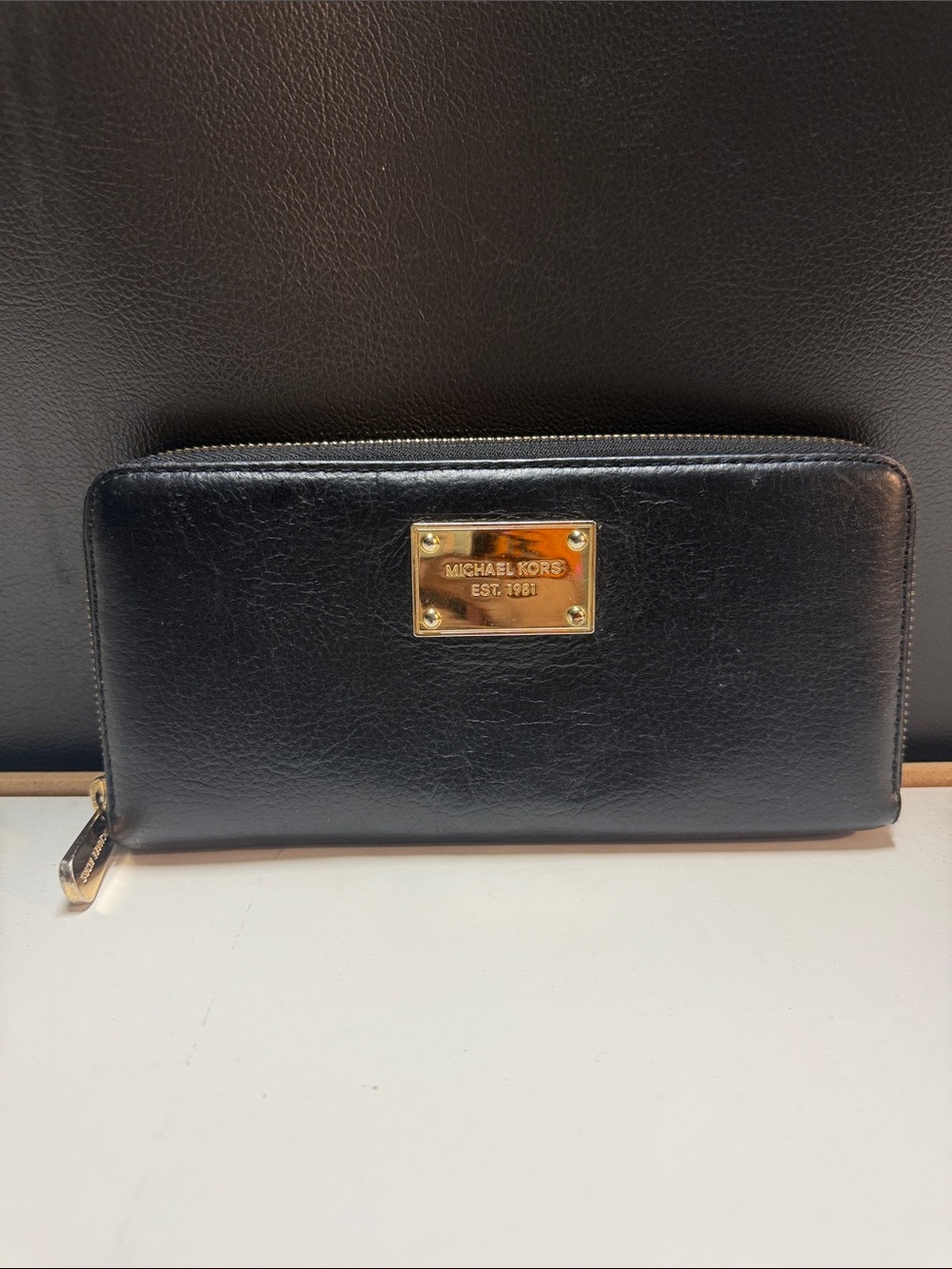 Michael Kors Black Leather Zip-Around Wallet with Gold Logo Plate